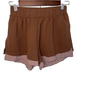 As Revival women’s size M elastic waist 2 tone 
Exposed liner running short